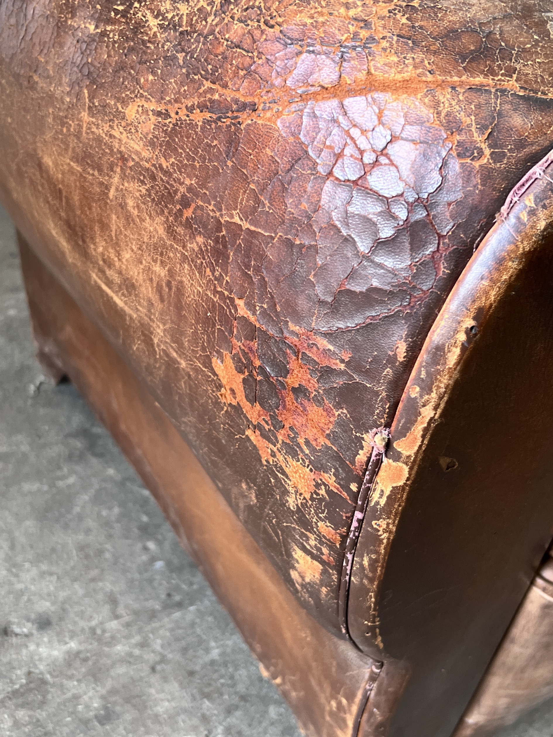 A mid century French tan leather club chair, width 94cm, depth 84cm, height 80cm